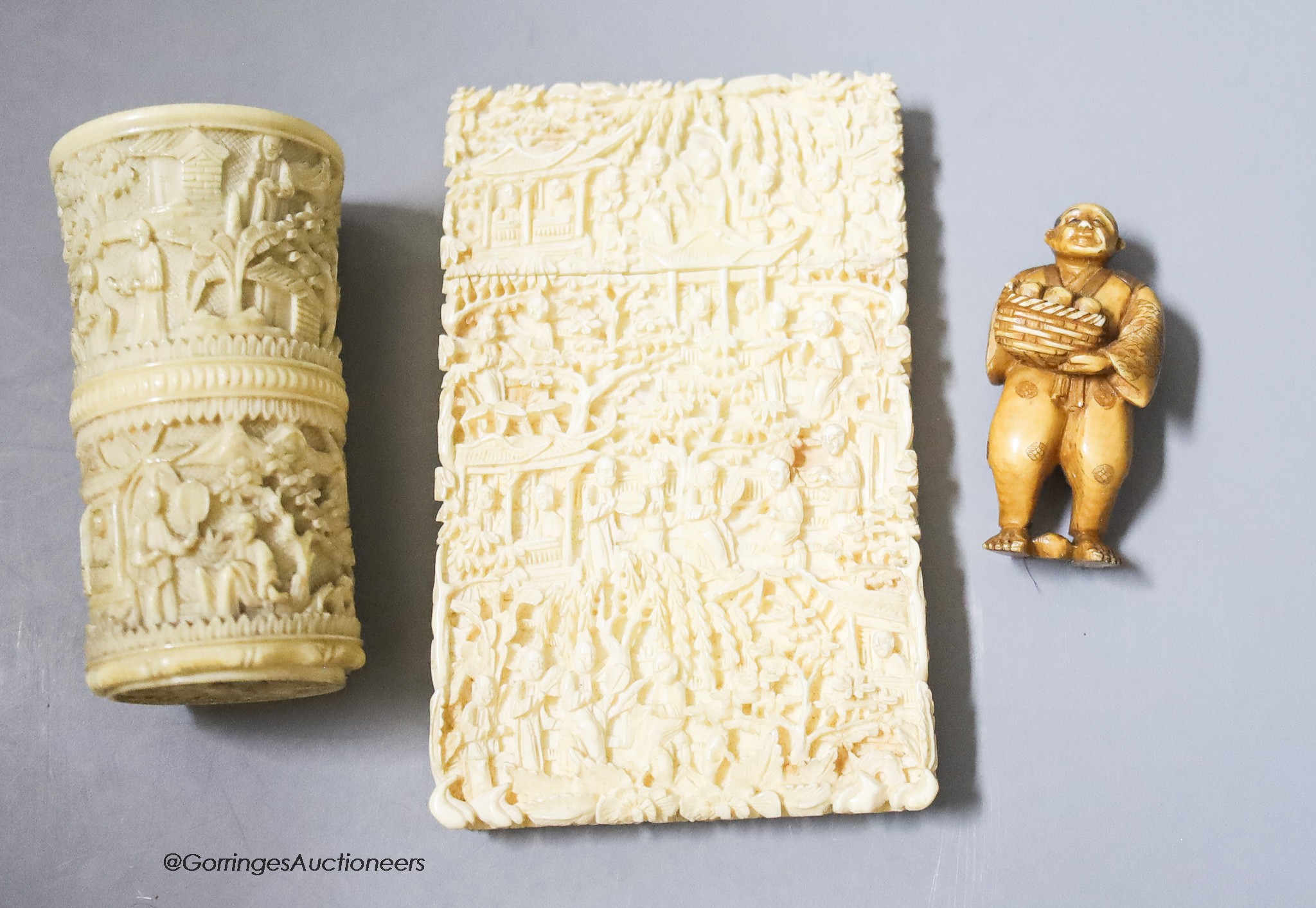 A Canton ivory card case, 11 x 7cm, a dice shaker and a Japanese netsuke